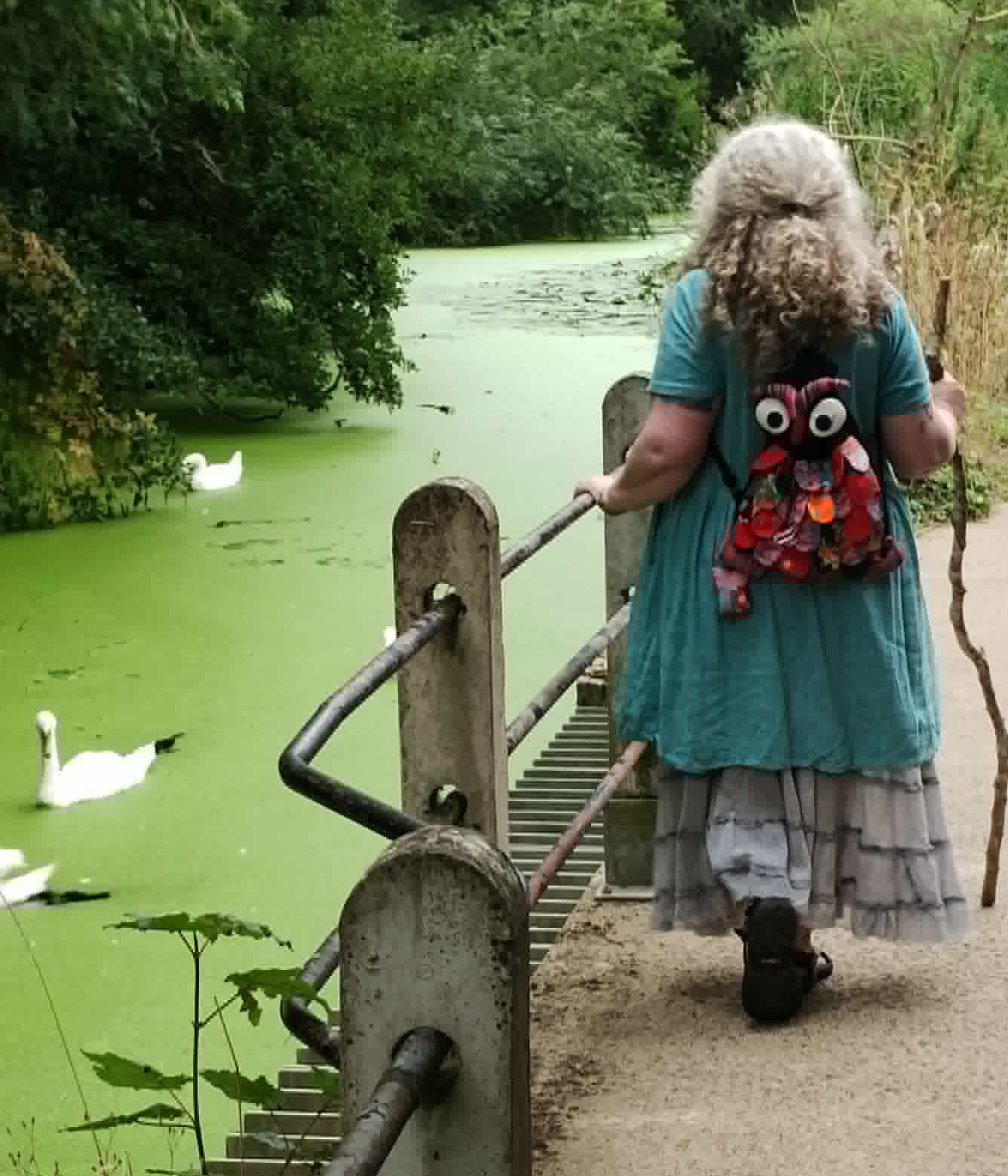 Susan Vinson walking through open countryside